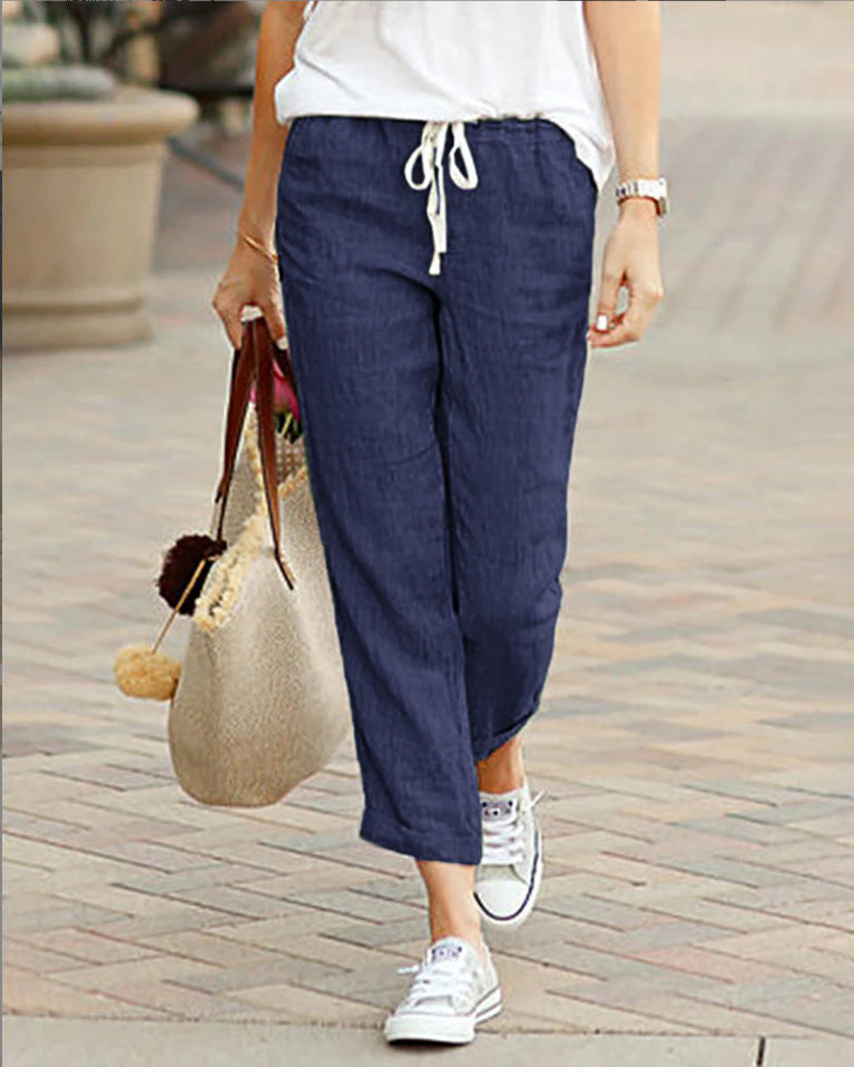 Navy women’s tulip-hem lantern trousers with drawstring waist and relaxed fit