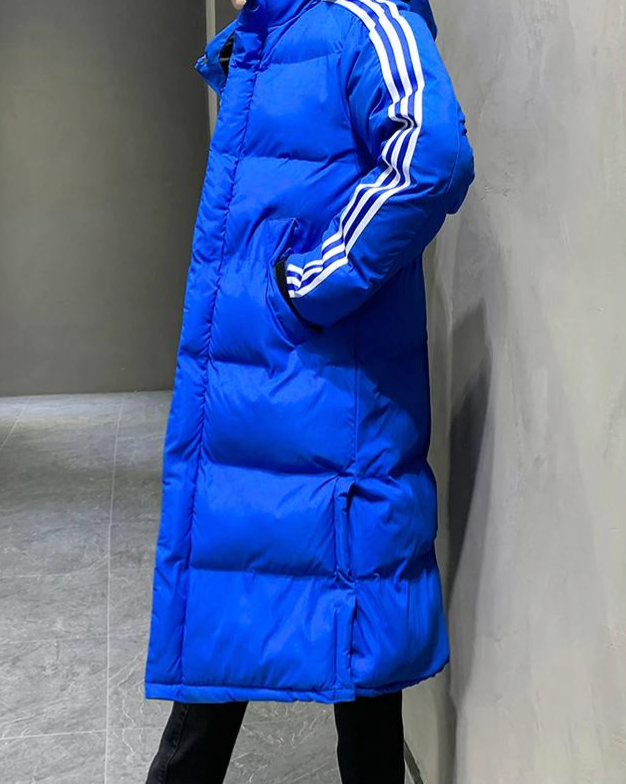 Blue long puffer jacket with hood and white stripe accents on sleeves