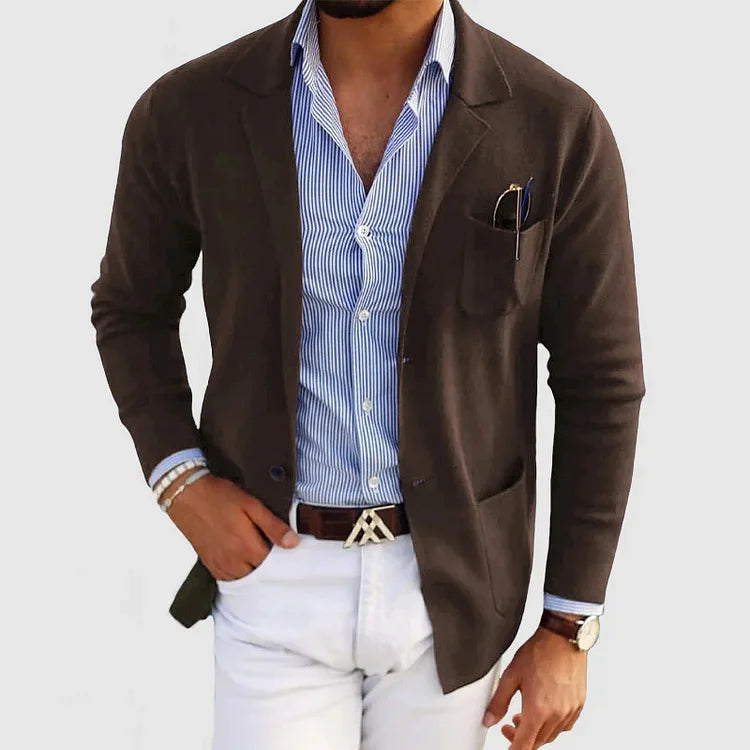 Men's brown blazer with notch lapels, chest pocket holding a pen, side pockets.