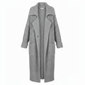 Grey chunky rib-knit longline cardigan with open front and side pockets, draped fit