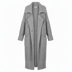 Grey chunky rib-knit longline cardigan with open front and side pockets, draped fit
