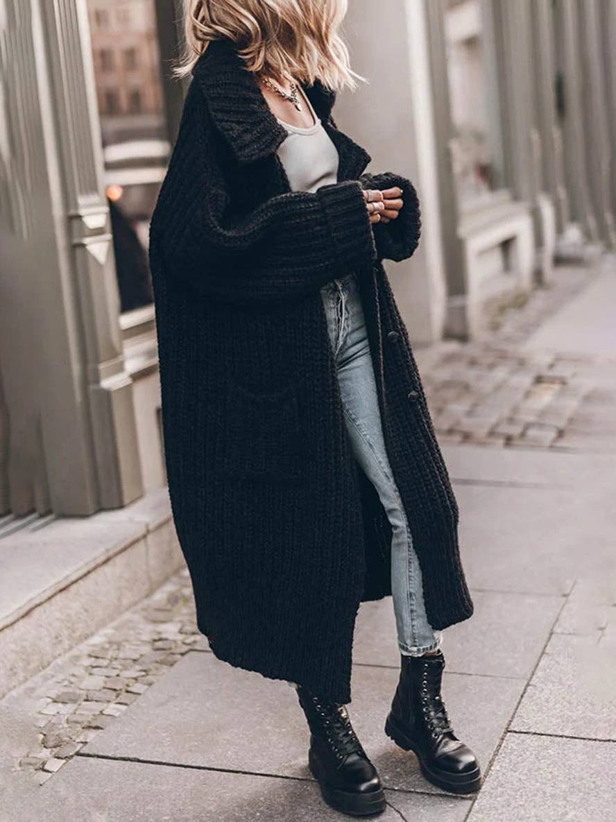 Black chunky rib-knit longline cardigan with open front and side pockets, textured knit