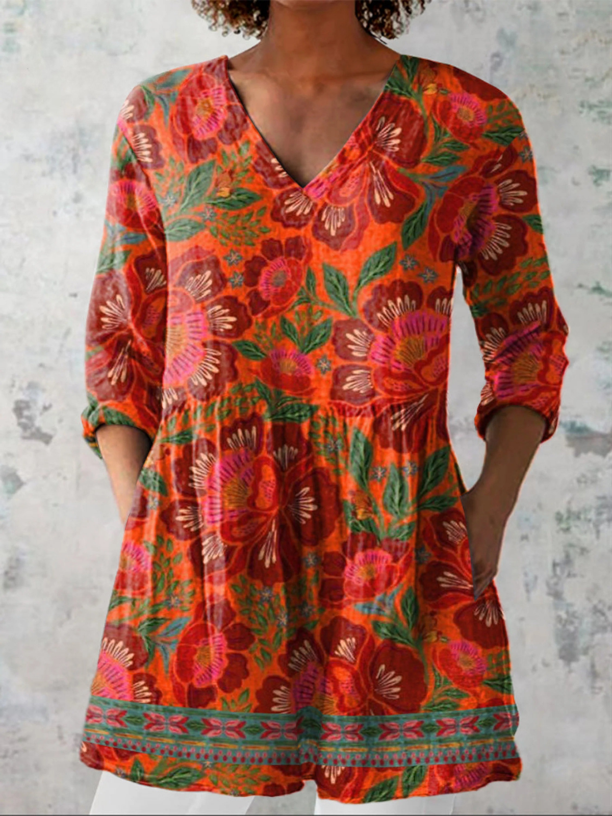 Long V-neck blouse with 3/4 sleeves, red orange floral leaf print
