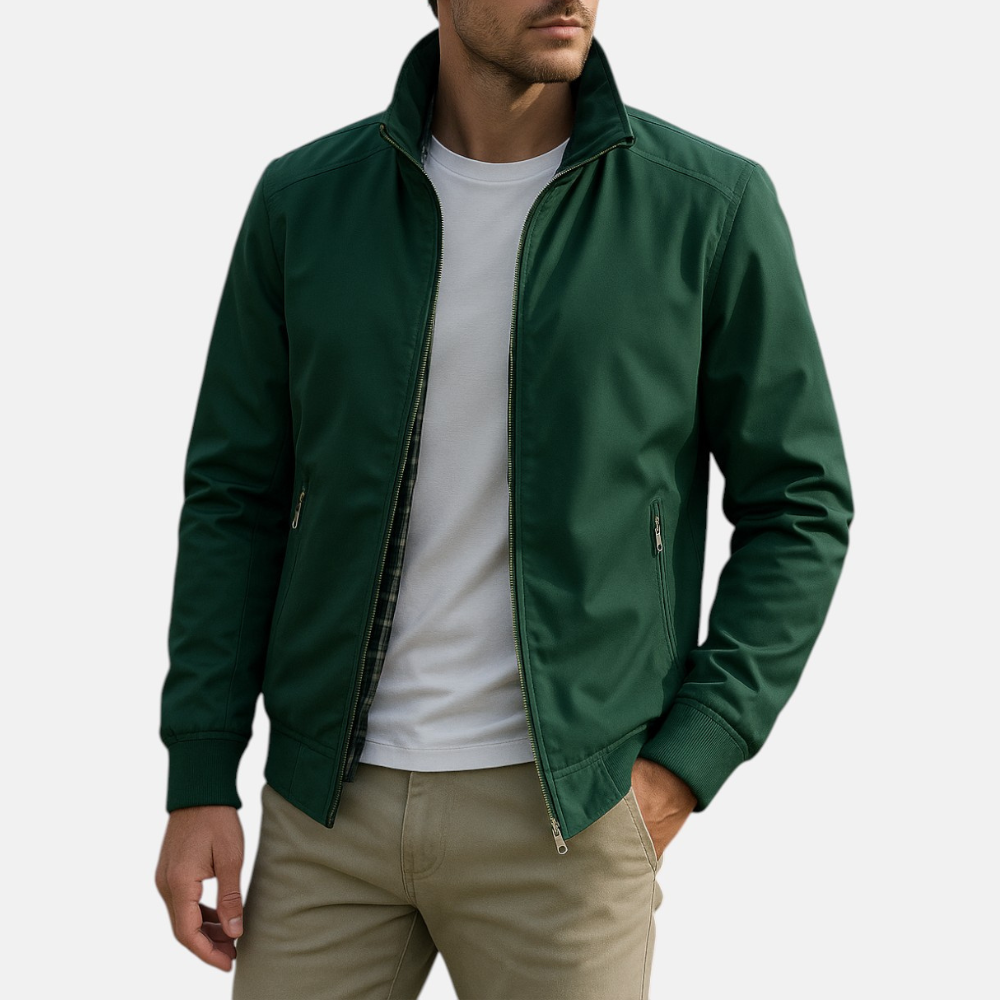 Men's green windbreaker jacket with full zip and zip pocket detail at chest.
