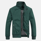 Men's dark green windbreaker jacket with full zip, stand collar, and zip front pockets.