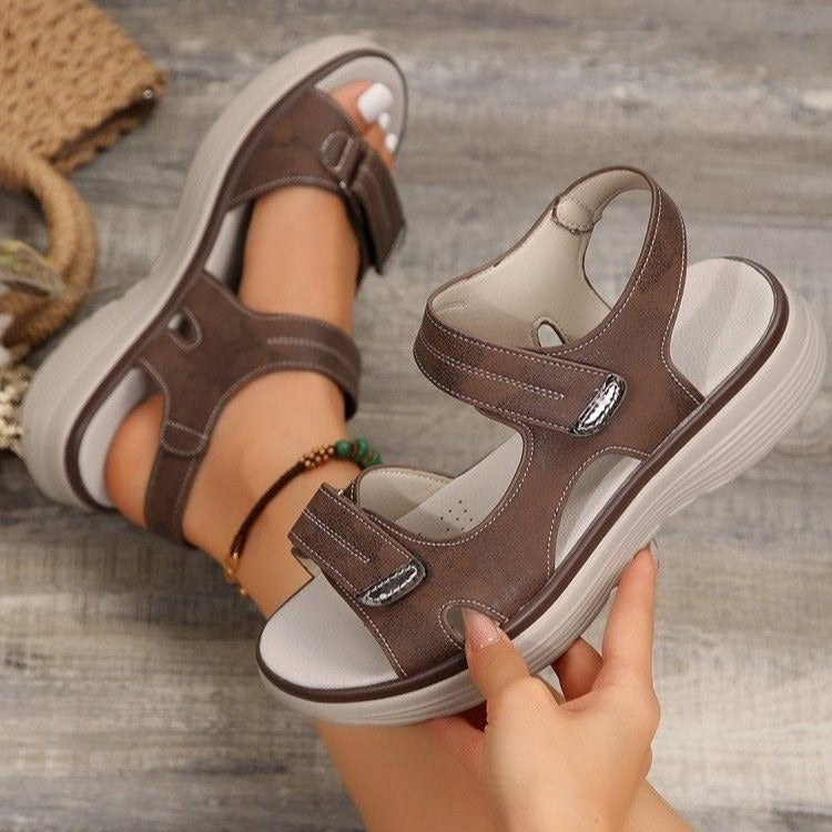 Women's brown open-toe slide sandals with adjustable buckles and cushioned sole