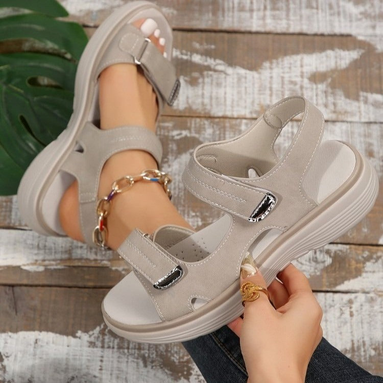 Women's beige open-toe slide sandals with adjustable straps and cushioned sole