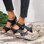 Women's open-toe slide sandals with adjustable straps in black and beige tones