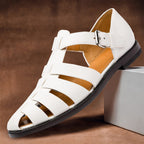 Women's white Velcro strap sandals with three-bar strap pattern and buckle