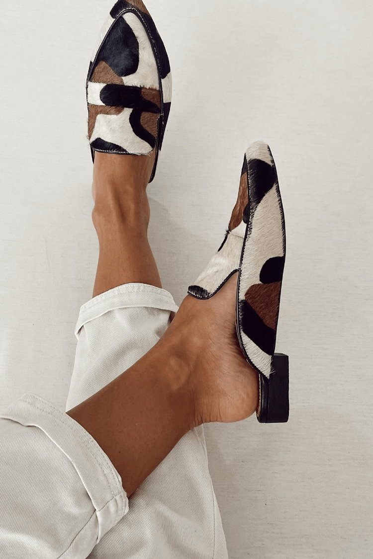 Women's animal print loafers, side view slip-on with white, brown, black patches