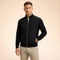 Men's black hybrid puffer jacket with full-zip and ribbed knit cuffs