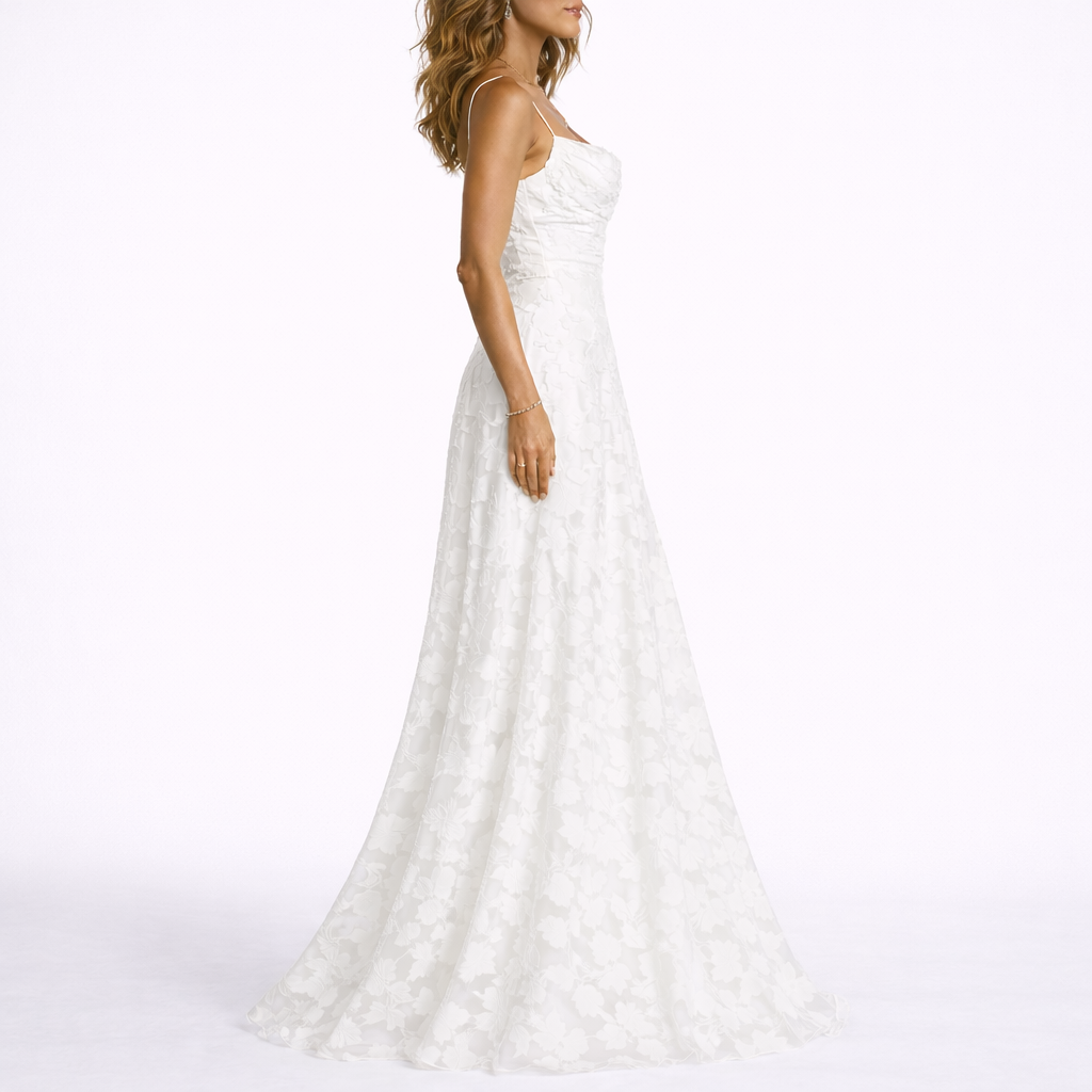 Women’s white floral textured maxi dress, side view with fitted bodice and flared skirt