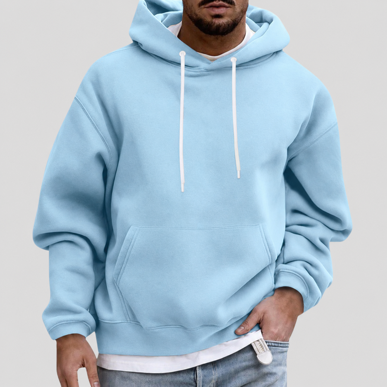 Light blue men’s pullover hoodie with white drawstring hood and kangaroo pocket.