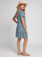 Blue tropical print knee-length dress with V-neck and short sleeves, side view