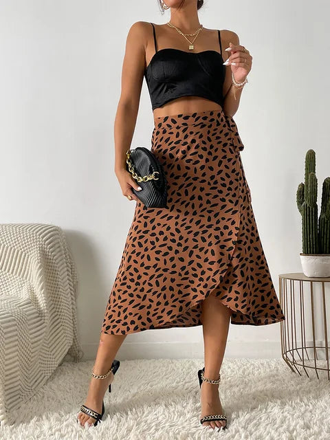 Women's tan midi wrap skirt with asymmetrical hem, dark animal print design