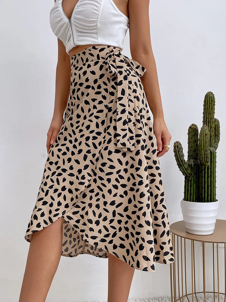 Women's khaki midi wrap skirt with asymmetrical hem, dark animal print design