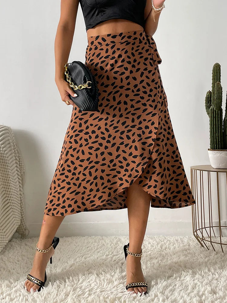 Women's rust-brown midi wrap skirt with asymmetrical hem, dark animal print