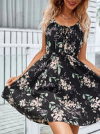 Women’s black tie-shoulder mini dress with pink floral print and gathered waist