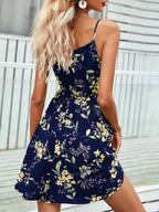 Women’s dark blue tie-shoulder mini dress with yellow floral print and flared skirt