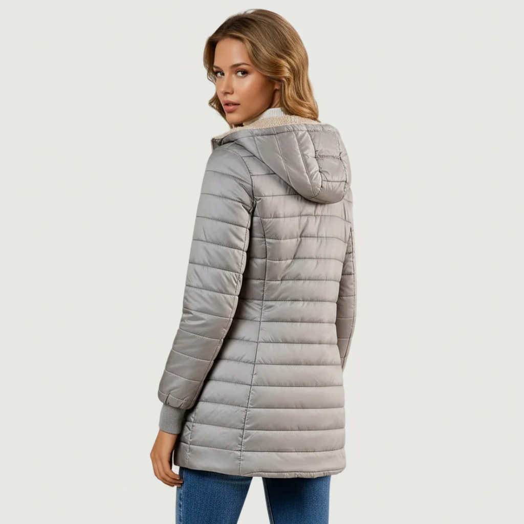 Light gray sherpa-lined winter coat with tan faux-fur hood and zip front (back)