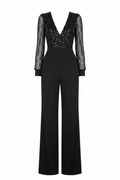 Black V-neck jumpsuit with sheer long sleeves, sparkly bodice, and wide-leg pants
