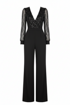 Black V-neck jumpsuit with sheer long sleeves, sparkly bodice, and wide-leg pants