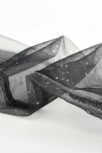 Sparkly sheer mesh fabric with glitter specks, sleeve-like texture