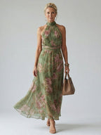 Women’s sleeveless halter midi dress in sage green with pink floral print, gathered bodice