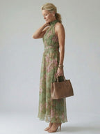 Women’s halter midi dress, sage green with pink floral print, defined waist and flowy skirt