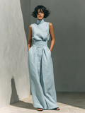 Light blue women's cotton sleeveless jumpsuit with high neck and tied waist