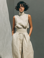 Khaki women's cotton jumpsuit with sleeveless high neck and draped belt waist