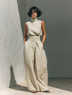 Khaki women's cotton jumpsuit with high neckline, draped waist tie and wide legs