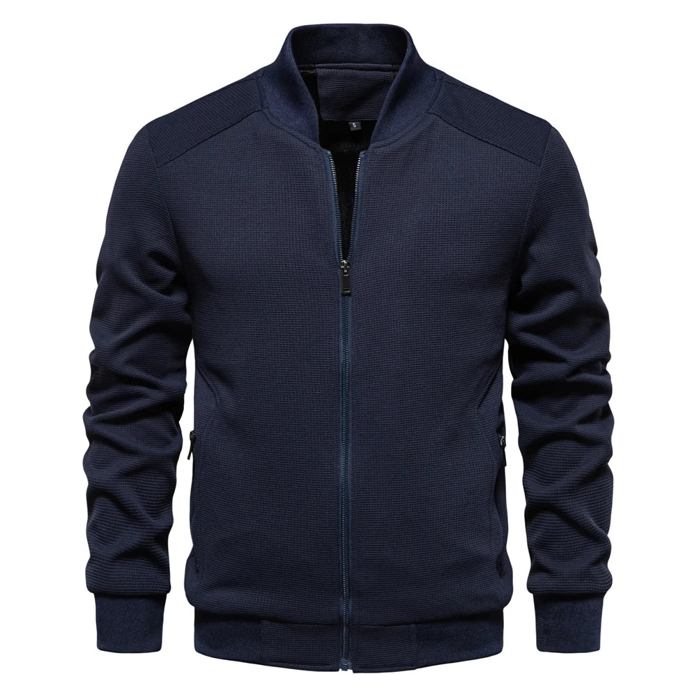 Men's navy zip-up bomber jacket with stand collar, ribbed cuffs, and side pockets