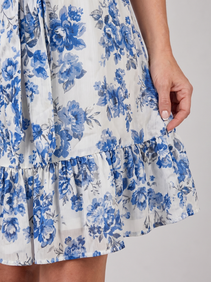 Blue floral print ruffle hem on white halter-neck fit-and-flare dress
