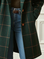 Dark green plaid long coat with brown buttons and ribbed cuffs