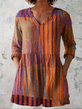 Long V-neck blouse with vertical orange and blue stripes, 3/4 sleeves, gathered waist