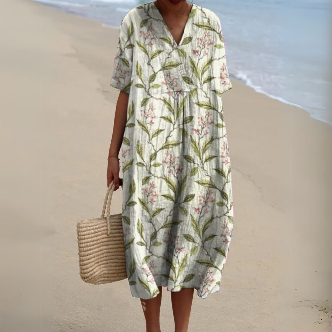 Women’s printed V-neck midi dress with adjustable waist, white base with green leaf flowers