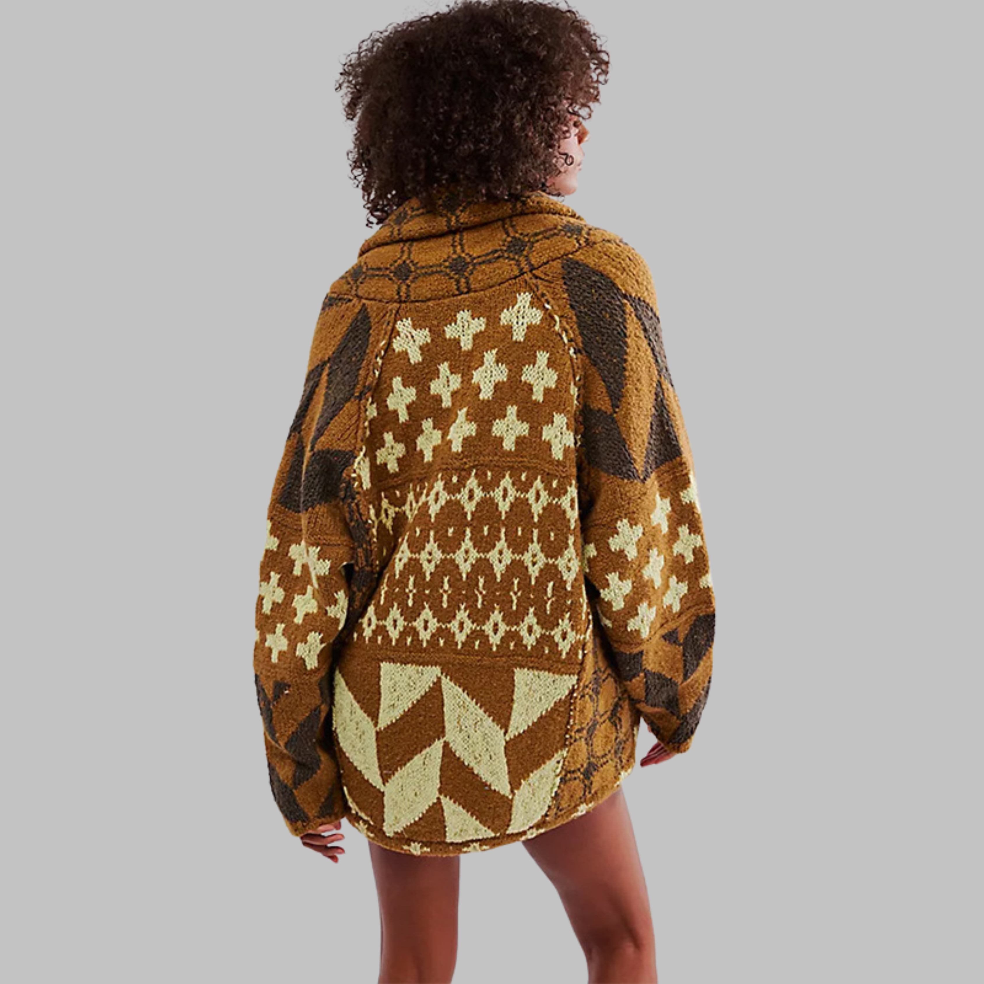 Brown oversized knit cardigan with tan crosses and arrow-shaped stripe panels.