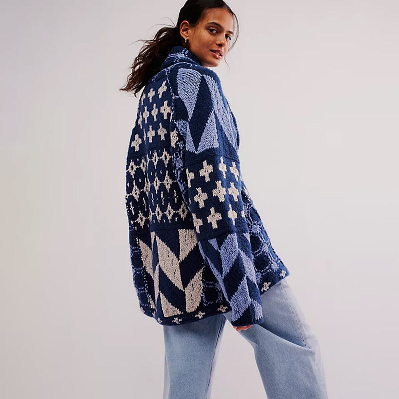 Blue oversized knit cardigan with white cross and diamond patterns, relaxed fit.