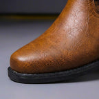 Men's cognac brown leather heritage boot toe with textured finish and black sole
