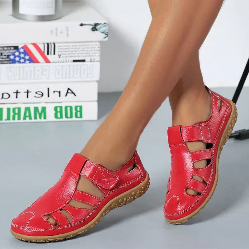 Women’s red orthopaedic non-slip sandals with open toe cutout straps and tan outsole