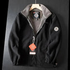 Black premium fleece vest with gray stand collar and full-zip front.