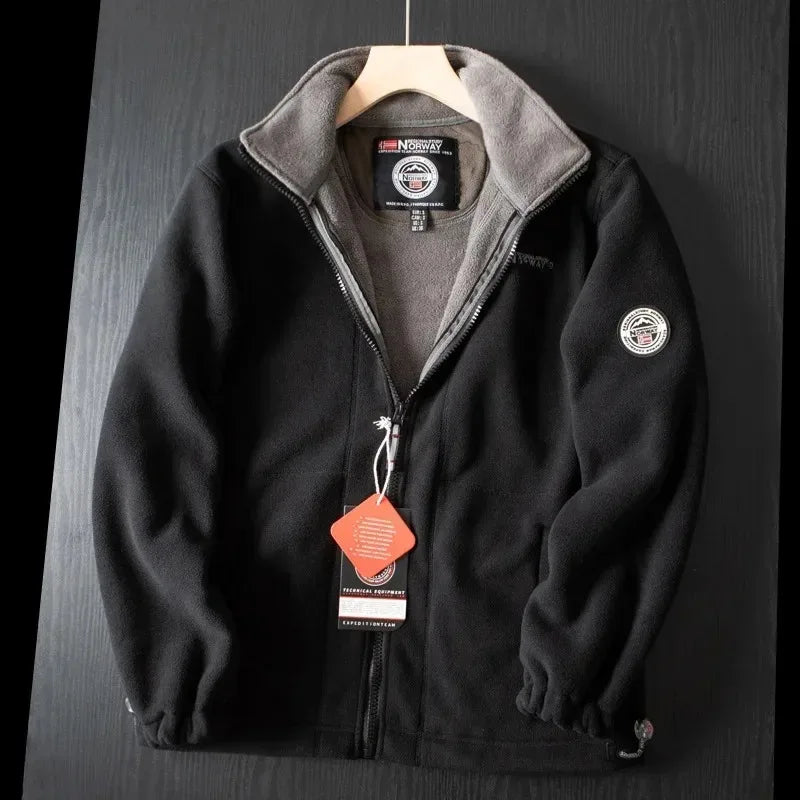 Black premium fleece vest with gray stand collar and full-zip front.