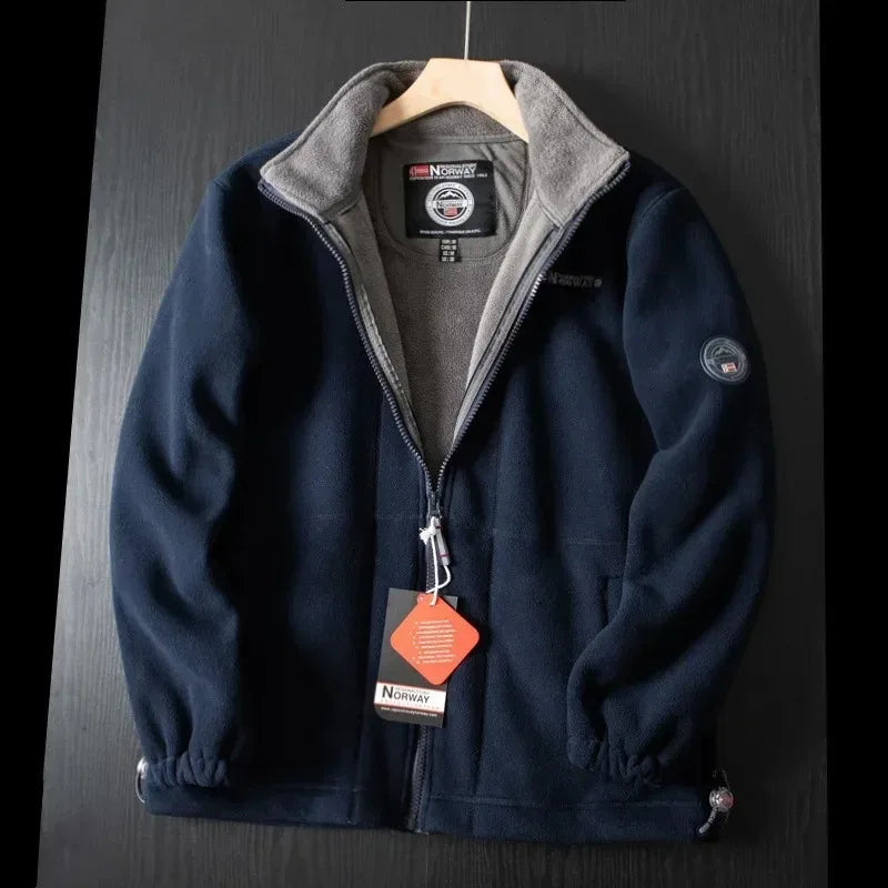 Blue premium fleece vest with gray stand collar and full-zip front.