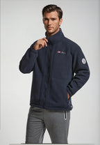 Navy premium fleece vest on model with gray collar and full-zip front.