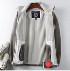 Light gray premium fleece vest with two zip pockets and full-zip front.