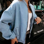 Light-blue denim bomber jacket with zip front and elastic cuffs