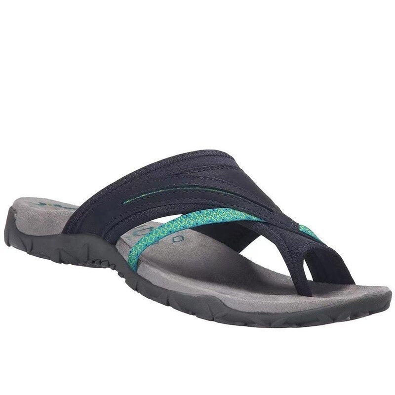 Women's dark navy open-toe flat sandals with teal-accented strap and moulded footbed