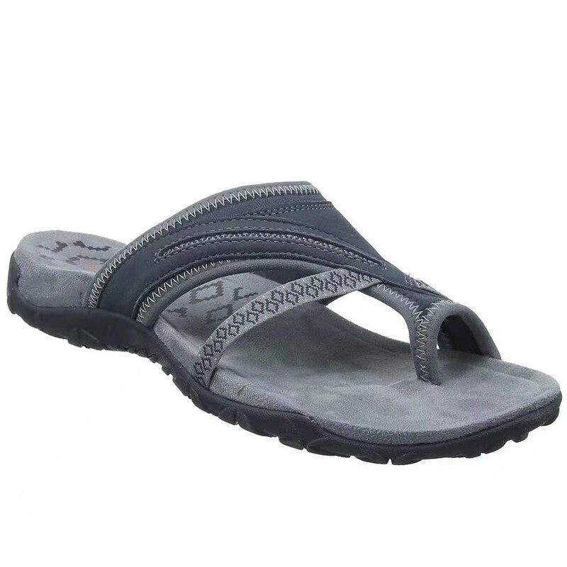 Women's dark blue open-toe flat sandals with patterned strap and cushioned sole