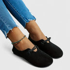 Black slip-on loafers with round toe and elastic strap, close side angle